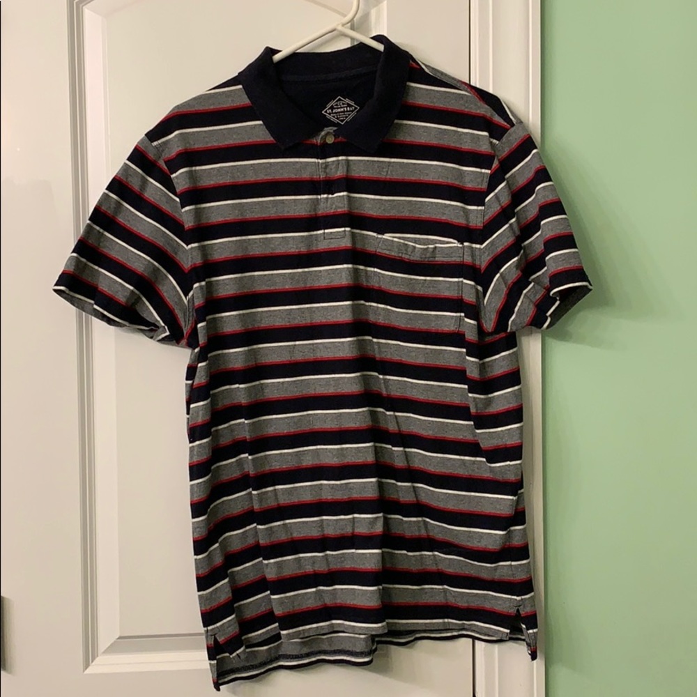 Large collard shirt with a pocket on the front.